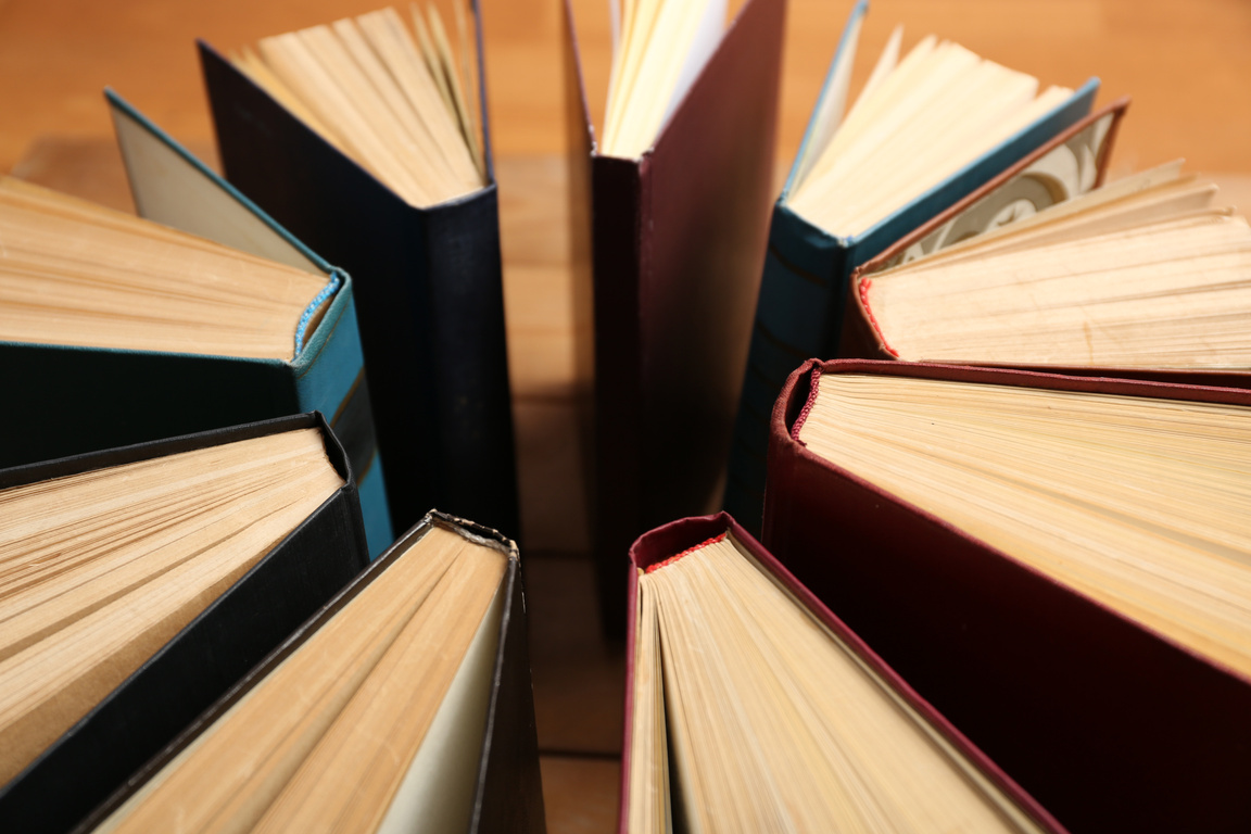 Books Arranged on Wooden Background